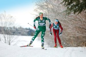 Two girls skiing in a nordic event
