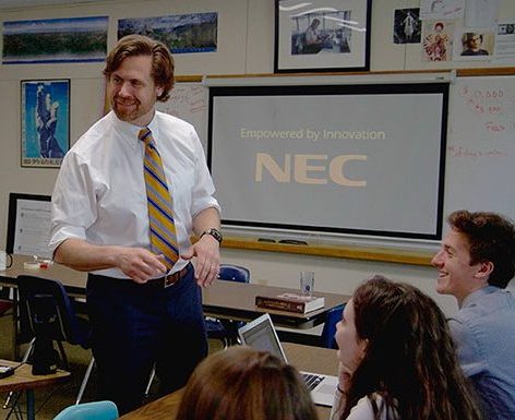Teacher interacting with students