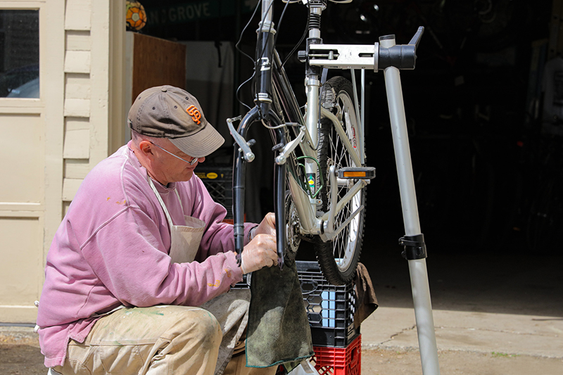 Chef David Hale working on a bike