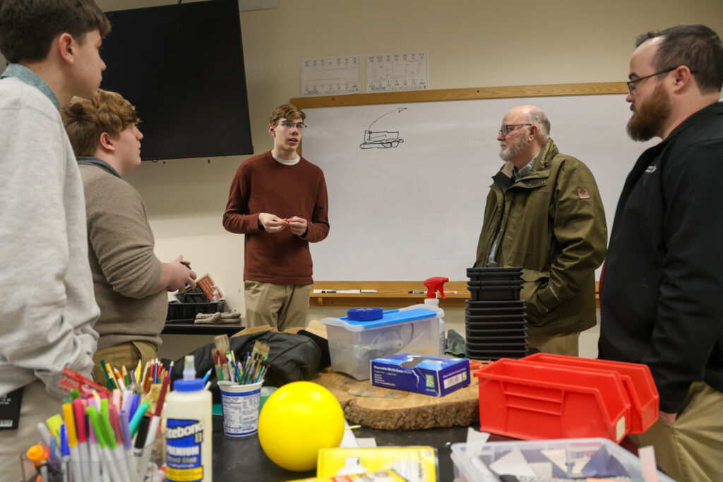 students talking to engineers