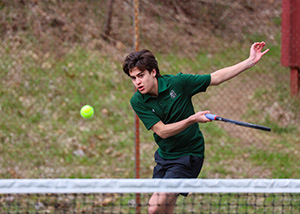 boy playing tennis