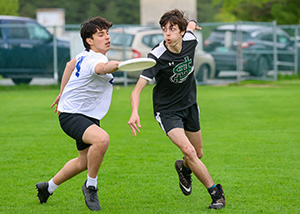 boy playing ultimate frisbee