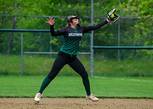 girl playing softball