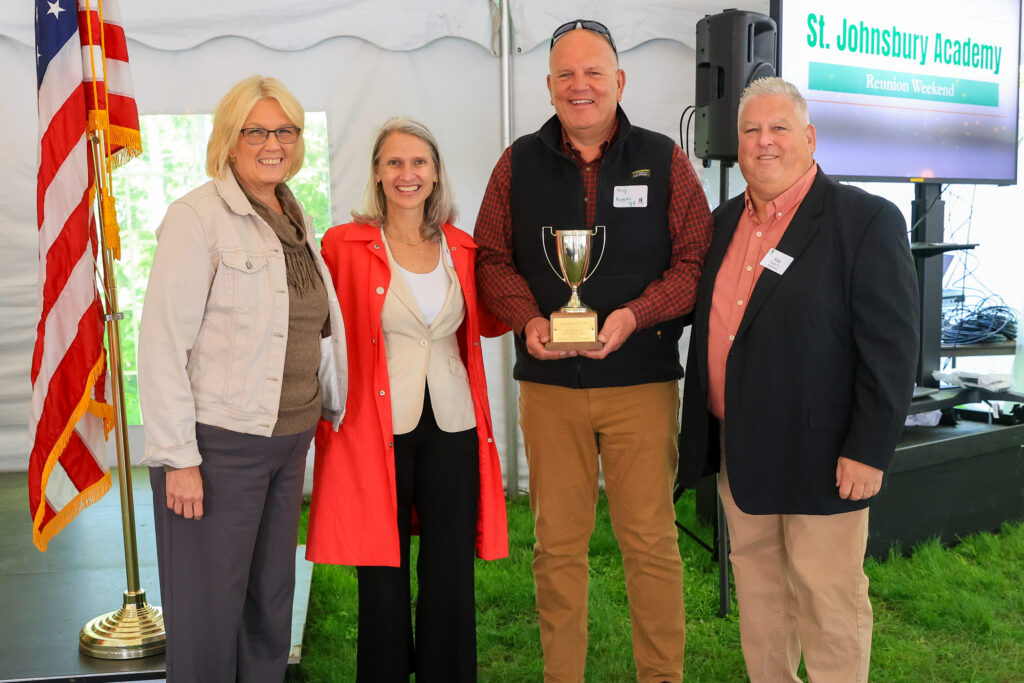 The Class of 1984 receives an award from the headmaster