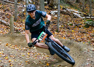 a boy mountain bike racing