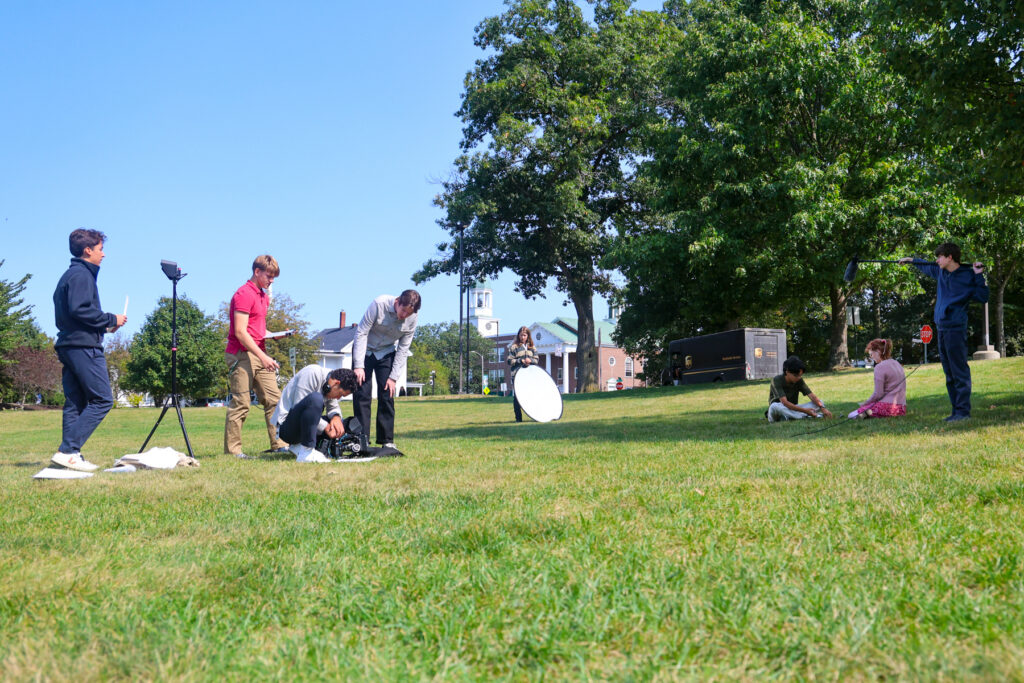 Film students set up a scene.