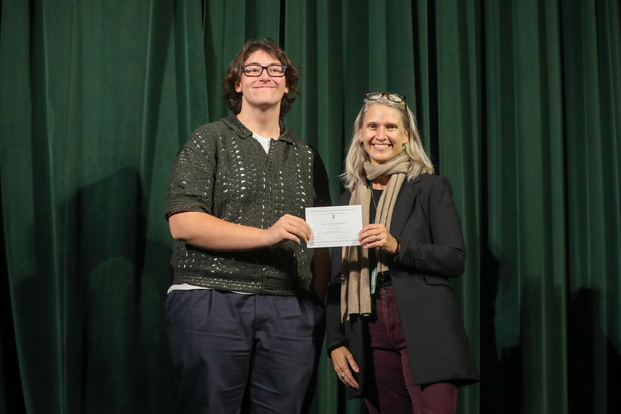 Student receives award from Dr. Howell.